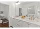 Bright bathroom features dual sinks, a large mirror, and sleek design, providing a modern and functional space at 676 Juneberry Se Ln, Atlanta, GA 30316
