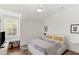 Cozy bedroom with a large window, modern ceiling fan and minimalist design, perfect for comfortable living at 676 Juneberry Se Ln, Atlanta, GA 30316