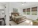 Bright, serene bedroom with neutral colors, plush bedding, and ample natural light at 676 Juneberry Se Ln, Atlanta, GA 30316