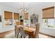 Bright dining room features natural light, complemented by rustic table and neutral toned decor at 676 Juneberry Se Ln, Atlanta, GA 30316