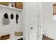 Functional entryway featuring shiplap accent wall, a built-in bench, and storage solutions at 676 Juneberry Se Ln, Atlanta, GA 30316