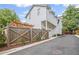 Exterior shot of home with fence, wooden pergola and driveway at 676 Juneberry Se Ln, Atlanta, GA 30316