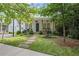 Charming home exterior with lush landscaping, stone pathway, and inviting front porch at 676 Juneberry Se Ln, Atlanta, GA 30316