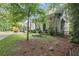Home exterior showcasing lush landscaping, a charming front porch, and classic architectural details at 676 Juneberry Se Ln, Atlanta, GA 30316