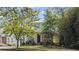 Charming home with a covered front porch surrounded by lush greenery at 676 Juneberry Se Ln, Atlanta, GA 30316
