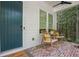 Cozy front porch with rocking chairs and rustic brick flooring, perfect for relaxing outdoors at 676 Juneberry Se Ln, Atlanta, GA 30316