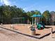 A vibrant playground set against a backdrop of mature trees at 8219 Coldstream Dr, Fairburn, GA 30213