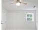Bedroom with ceiling fan, natural light from window, and access to private patio at 831 Sweet Briar Se Ln, Conyers, GA 30094