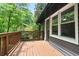 Charming outdoor deck area with wood railings and peaceful backyard views at 831 Sweet Briar Se Ln, Conyers, GA 30094
