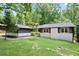 Well maintained front lawn of a house with updated siding, trim, and an inviting facade at 831 Sweet Briar Se Ln, Conyers, GA 30094