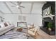 Stylish living room boasts high vaulted ceilings and a striking stone fireplace at 831 Sweet Briar Se Ln, Conyers, GA 30094