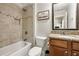 Neutral bathroom featuring a tub-shower combo with neutral tile and granite vanity at 1446 Wilford Ne Dr, Atlanta, GA 30319