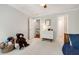Cozy bedroom with a ceiling fan, plush carpeting, and generous natural light at 1446 Wilford Ne Dr, Atlanta, GA 30319