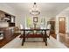 Dining room with hardwood floors, elegant chandelier, ample natural light, and stylish furnishings at 1446 Wilford Ne Dr, Atlanta, GA 30319
