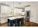 Spacious kitchen features a large center island with barstool seating and stainless appliances at 1446 Wilford Ne Dr, Atlanta, GA 30319
