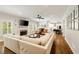 Open living room features recessed lighting, fireplace and views into the kitchen at 1446 Wilford Ne Dr, Atlanta, GA 30319