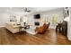 Bright living room features a fireplace, large windows and beautiful hardwood floors at 1446 Wilford Ne Dr, Atlanta, GA 30319