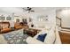 Open concept living room flows into kitchen, features hardwood floors and neutral colors at 1446 Wilford Ne Dr, Atlanta, GA 30319