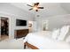 Bright main bedroom features a ceiling fan, walk in closet, and an ensuite bathroom at 1446 Wilford Ne Dr, Atlanta, GA 30319