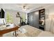Home office with a desk, an exercise bike, and a storage unit at 1446 Wilford Ne Dr, Atlanta, GA 30319