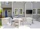 Well-equipped outdoor kitchen with built-in grill, countertop seating, and a wall-mounted television at 1446 Wilford Ne Dr, Atlanta, GA 30319