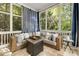 Cozy sunroom features floor to ceiling windows and an outdoor view at 1446 Wilford Ne Dr, Atlanta, GA 30319