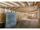 Large unfinished basement with wooden walls and flooring and plenty of potential at 3311 Lavista Dr, Hapeville, GA 30354