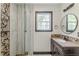 Modern bathroom with glass enclosed shower, decorative tile, and dark wood vanity at 3311 Lavista Dr, Hapeville, GA 30354