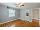 Bedroom with hardwood floors, ceiling fan, and a door with decorative glass at 3311 Lavista Dr, Hapeville, GA 30354