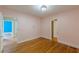 Bedroom featuring hardwood floors, fresh paint, and natural light at 3311 Lavista Dr, Hapeville, GA 30354