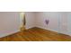 Spacious bedroom with hardwood floors and soft pink walls, ready for personalization at 3311 Lavista Dr, Hapeville, GA 30354