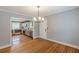 Bright dining room connected to modern kitchen with stainless steel appliances at 3311 Lavista Dr, Hapeville, GA 30354