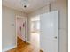 View of the hallway with hardwood floors and white doors with passage to other rooms at 3311 Lavista Dr, Hapeville, GA 30354