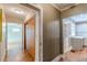 Hallway with hardwood floors showing passage to bedroom and kitchen at 3311 Lavista Dr, Hapeville, GA 30354