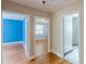 Hallway featuring three doorways leading to bedrooms and bathroom at 3311 Lavista Dr, Hapeville, GA 30354
