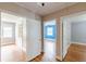 Hallway featuring doorways to bedrooms and an abundance of natural light at 3311 Lavista Dr, Hapeville, GA 30354