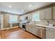 Well-lit kitchen with stainless steel appliances, quartz countertops, and mosaic tile backsplash at 3311 Lavista Dr, Hapeville, GA 30354