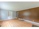 Inviting living room with hardwood floors, built-in shelving, and neutral wall colors at 3311 Lavista Dr, Hapeville, GA 30354