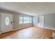 Bright living room with hardwood floors, built-in shelving, and ample natural light at 3311 Lavista Dr, Hapeville, GA 30354