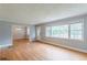 Spacious living room with hardwood floors, large windows, and neutral paint at 3311 Lavista Dr, Hapeville, GA 30354