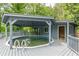 Elevated gray deck featuring a covered in-ground pool at 3311 Lavista Dr, Hapeville, GA 30354