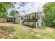 Exterior view of a cozy home with a back porch and landscaped backyard at 3311 Lavista Dr, Hapeville, GA 30354