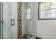 Close-up of a tiled shower with glass doors and modern fixtures at 3311 Lavista Dr, Hapeville, GA 30354