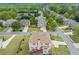 An aerial view of the house shows a deck and a lush yard with trees at 4605 Heathcliff Way, Cumming, GA 30041