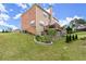 The back exterior shows a landscaped yard, a deck, and a covered patio at 4605 Heathcliff Way, Cumming, GA 30041