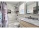 Bright bathroom featuring tub-shower combination and marble countertop at 4605 Heathcliff Way, Cumming, GA 30041