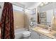 Stylish bathroom with a granite countertop and shower-tub combo at 4605 Heathcliff Way, Cumming, GA 30041