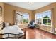 Comfortable bedroom with hardwood floors and plenty of natural light at 4605 Heathcliff Way, Cumming, GA 30041