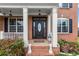 Elegant front entry featuring a detailed door, sidelights, and brick steps at 4605 Heathcliff Way, Cumming, GA 30041