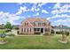 Beautiful two-story brick home with a manicured lawn and colorful flowerbeds at 4605 Heathcliff Way, Cumming, GA 30041